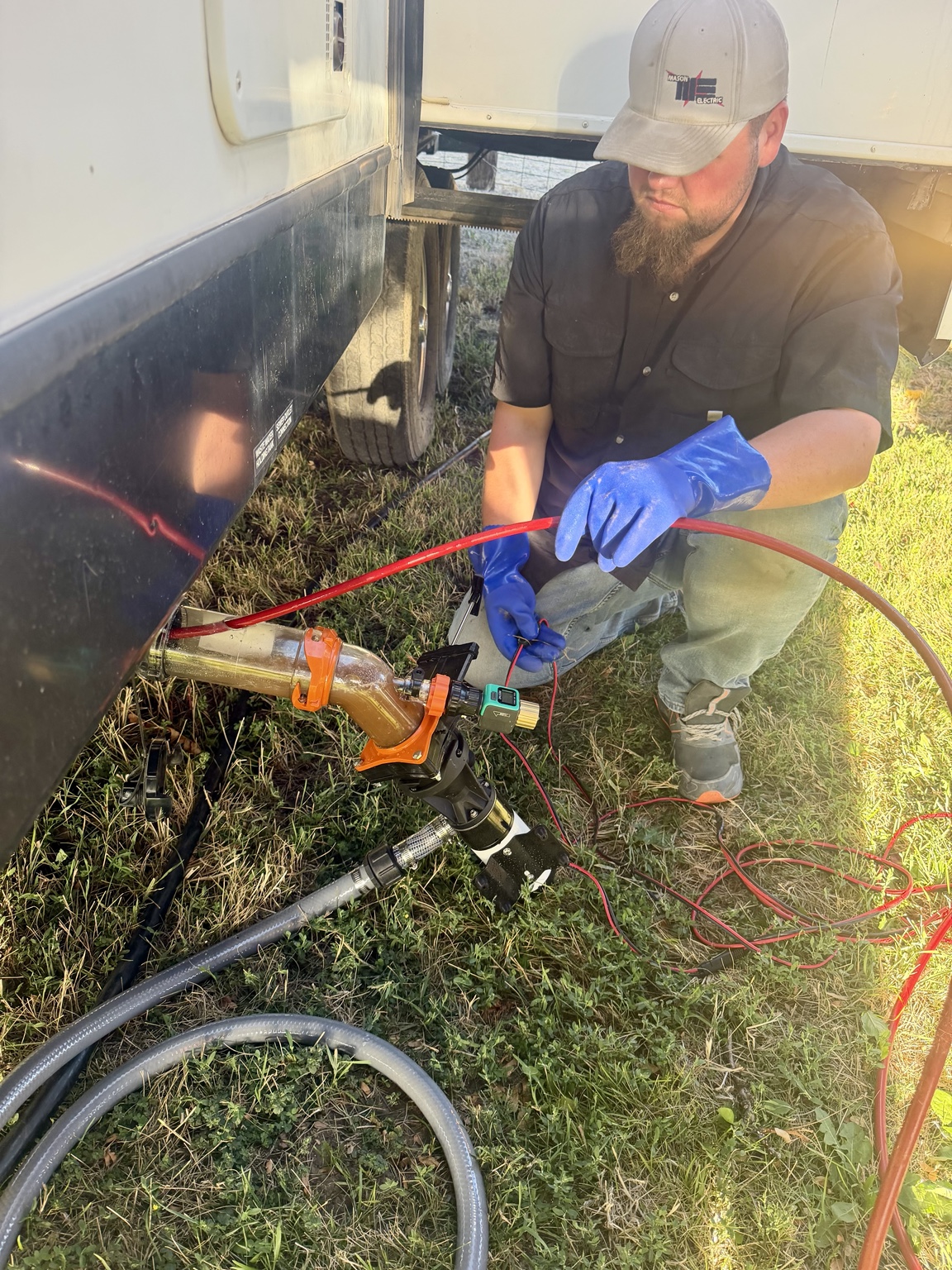 RV tank cleaning hose in use