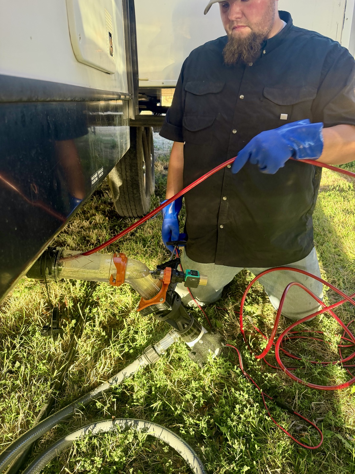 Black Tank Experts servicing an RV holding tank